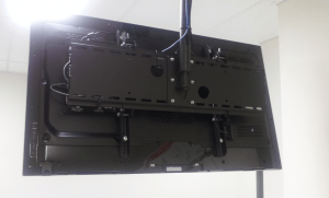 digital signage player behind screen