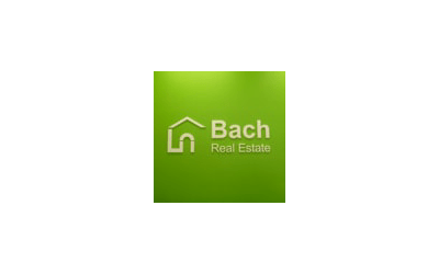 Advertise Me Digital Signage Bach Real Estate Logo